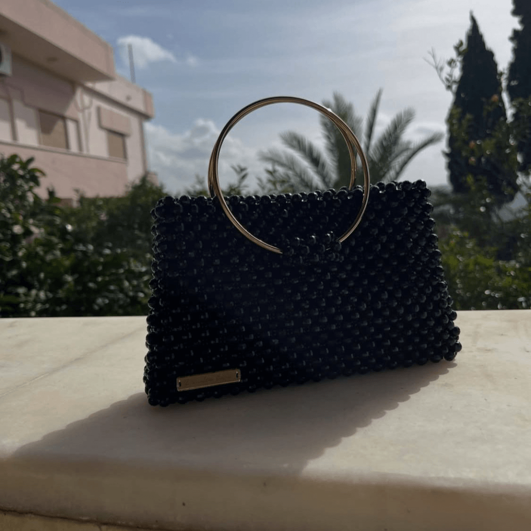 جزدان كريستال مع مسكة حديدية
